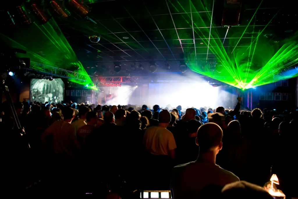 Crowd beneath green laser light at Bloc Weekend 2009 in Minehead.